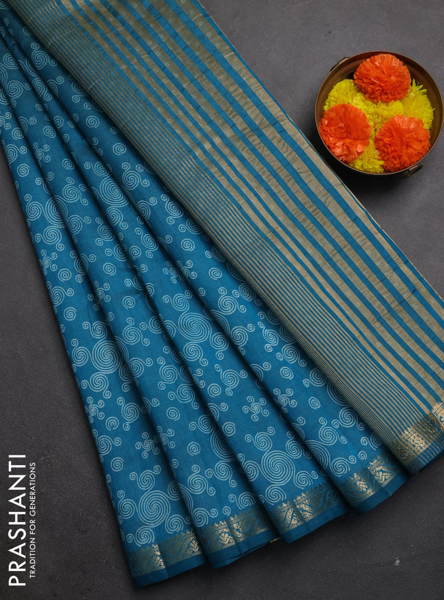 Semi raw silk saree teal blue with allover geometric prints and zari woven border