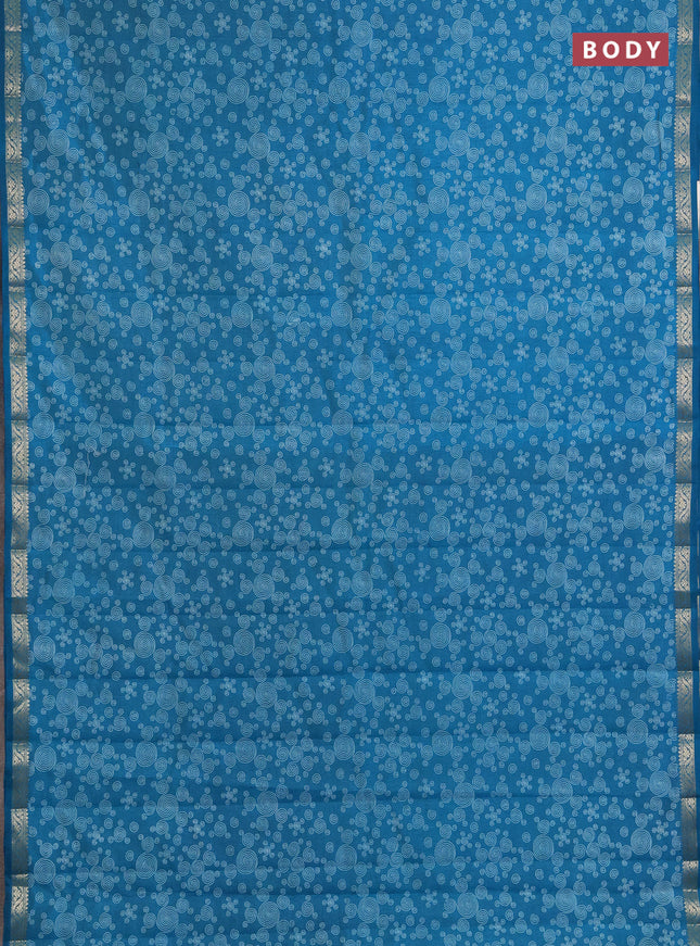 Semi raw silk saree teal blue with allover geometric prints and zari woven border