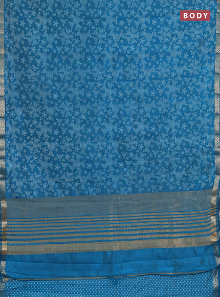 Semi raw silk saree teal blue with allover geometric prints and zari woven border