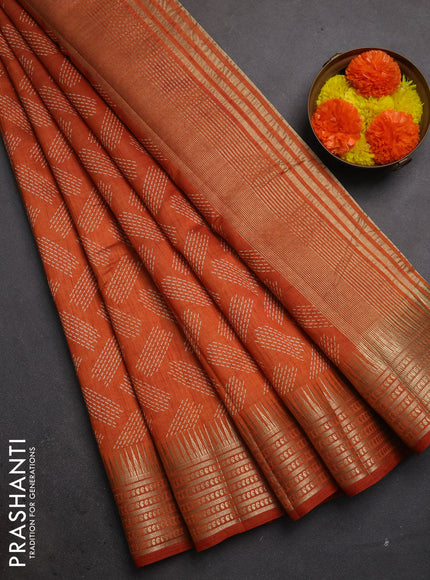 Semi raw silk saree rustic orange with allover geometric butta prints and temple design zari woven border