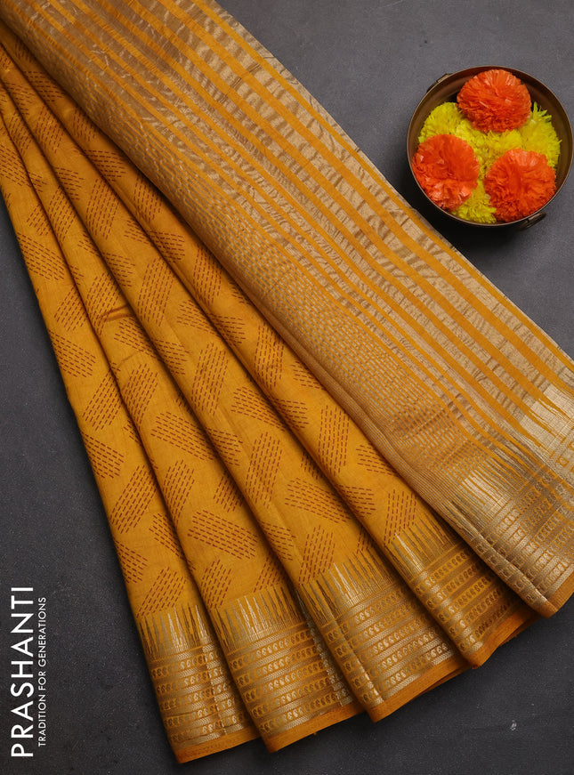 Semi raw silk saree dark mustard with allover geometric butta prints and temple design zari woven border