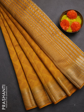 Semi raw silk saree dark mustard with allover geometric butta prints and temple design zari woven border