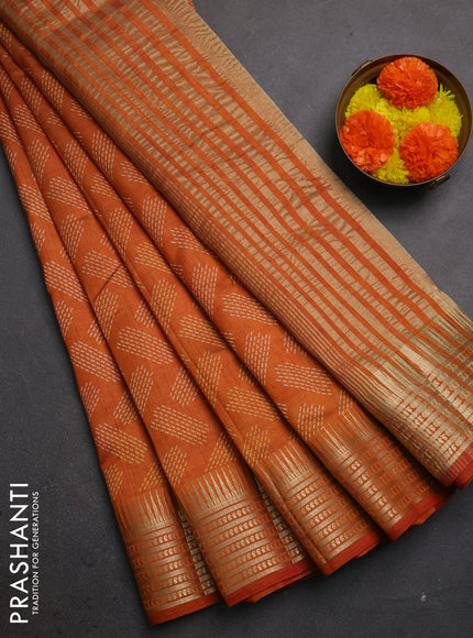 Semi raw silk saree rust with allover geometric butta prints and temple design zari woven border