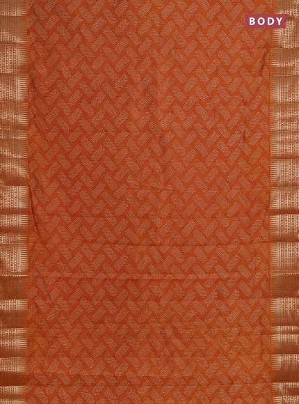 Semi raw silk saree rust with allover geometric butta prints and temple design zari woven border