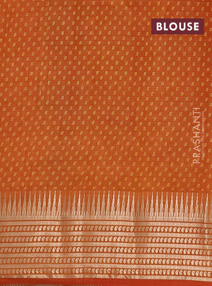 Semi raw silk saree rust with allover geometric butta prints and temple design zari woven border