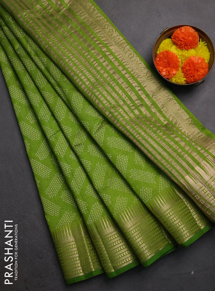 Semi raw silk saree light green with allover geometric butta prints and temple design zari woven border