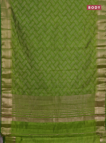 Semi raw silk saree light green with allover geometric butta prints and temple design zari woven border