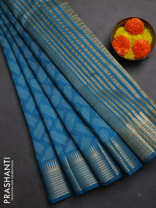 Semi raw silk saree teal blue with allover geometric butta prints and temple design zari woven border