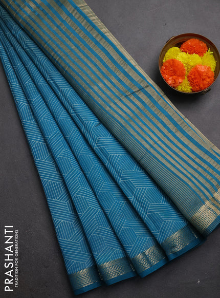Semi raw silk saree teal blue with allover geometric prints and zari woven border
