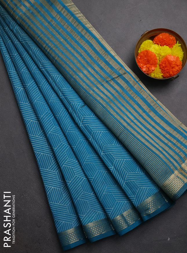 Semi raw silk saree teal blue with allover geometric prints and zari woven border