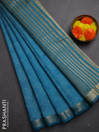 Semi raw silk saree teal blue with allover geometric prints and zari woven border