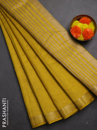 Semi raw silk saree lime yellow shade with allover geometric prints and zari woven border