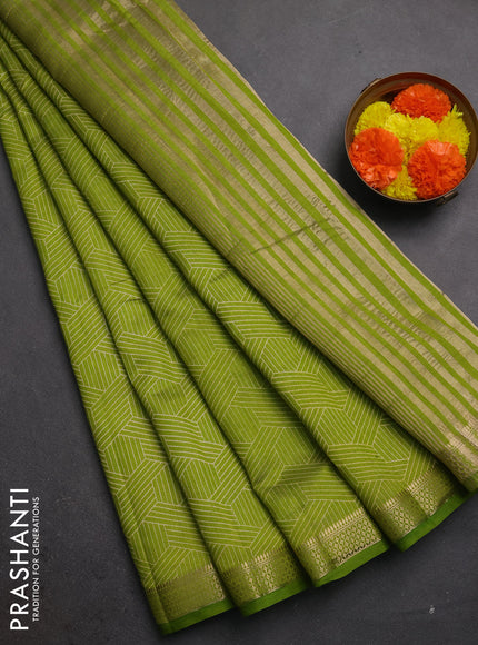 Semi raw silk saree light green with allover geometric prints and zari woven border