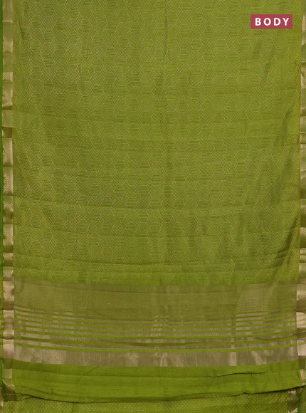 Semi raw silk saree light green with allover geometric prints and zari woven border