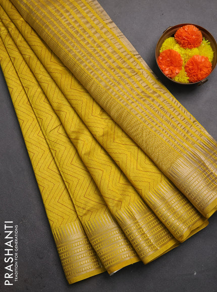 Semi raw silk saree mustard yellow with allover zigzag prints and temple design zari woven border