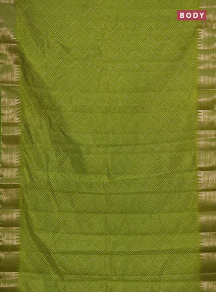 Semi raw silk saree light green with allover zigzag prints and temple design zari woven border