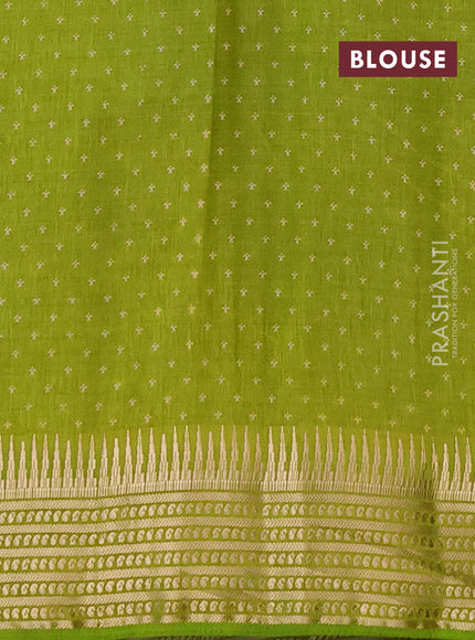 Semi raw silk saree light green with allover zigzag prints and temple design zari woven border