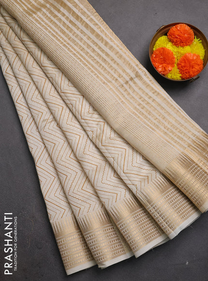 Semi raw silk saree cream with allover zigzag prints and temple design zari woven border