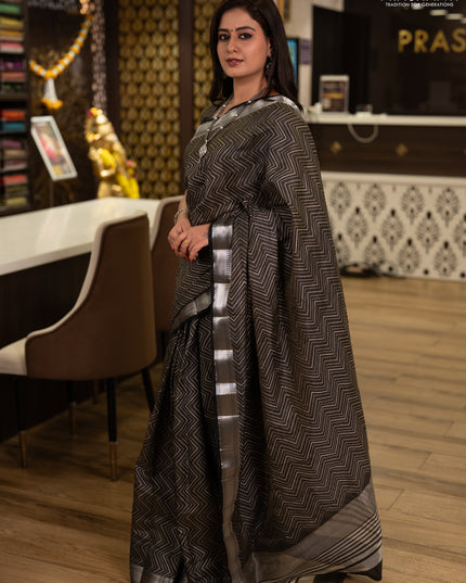 Semi raw silk saree olive green with allover zigzag prints and temple design zari woven border