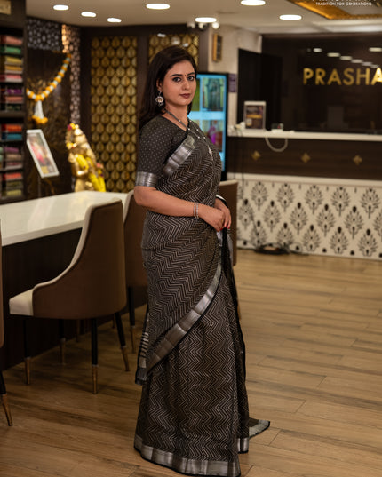 Semi raw silk saree olive green with allover zigzag prints and temple design zari woven border