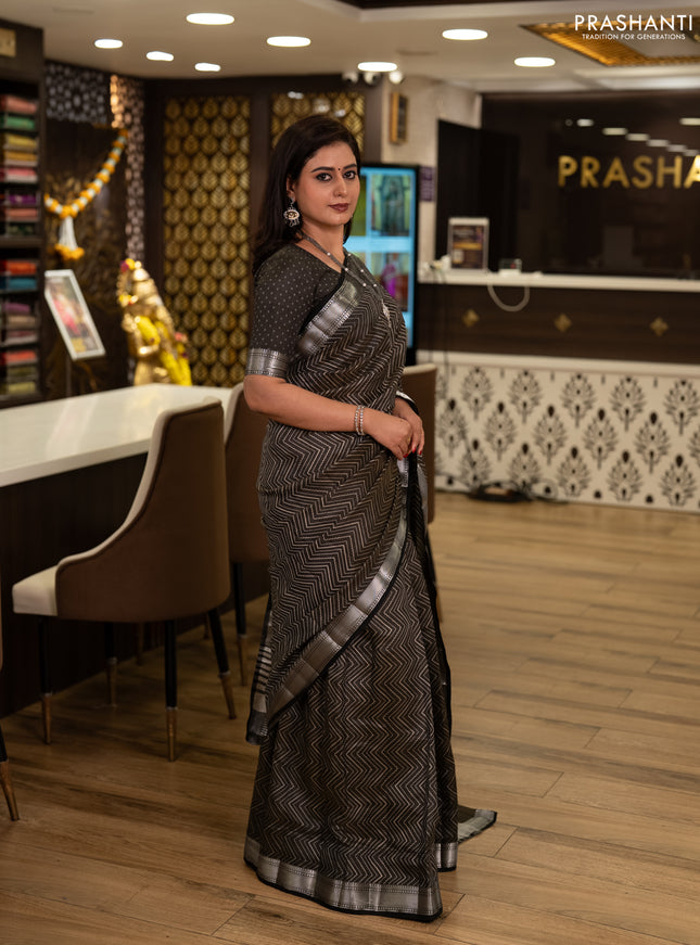Semi raw silk saree olive green with allover zigzag prints and temple design zari woven border