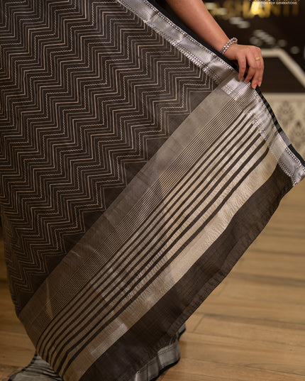 Semi raw silk saree olive green with allover zigzag prints and temple design zari woven border