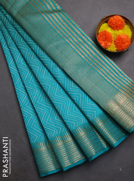 Semi raw silk saree teal green with allover zigzag prints and temple design zari woven border