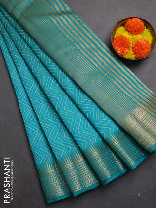 Semi raw silk saree teal green with allover zigzag prints and temple design zari woven border