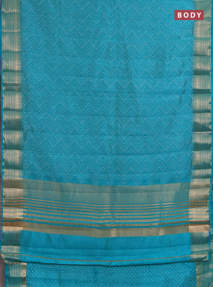 Semi raw silk saree teal green with allover zigzag prints and temple design zari woven border