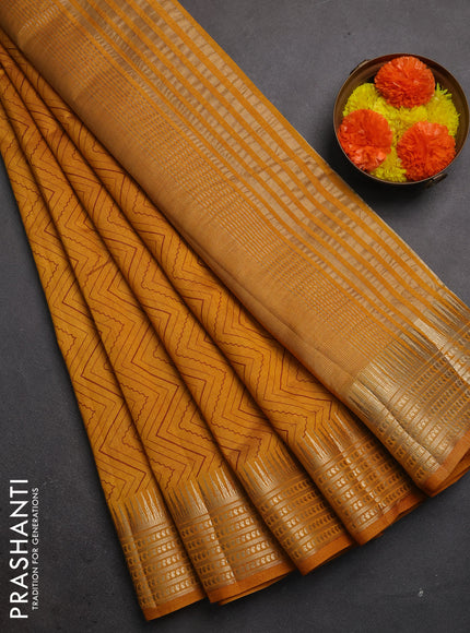 Semi raw silk saree dark mustard with allover zigzag prints and temple design zari woven border