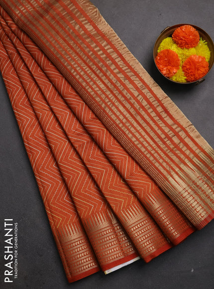 Semi raw silk saree rustic orange with allover zigzag prints and temple design zari woven border