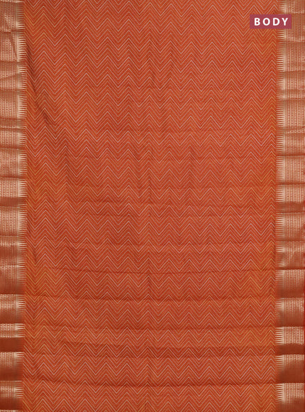 Semi raw silk saree rustic orange with allover zigzag prints and temple design zari woven border