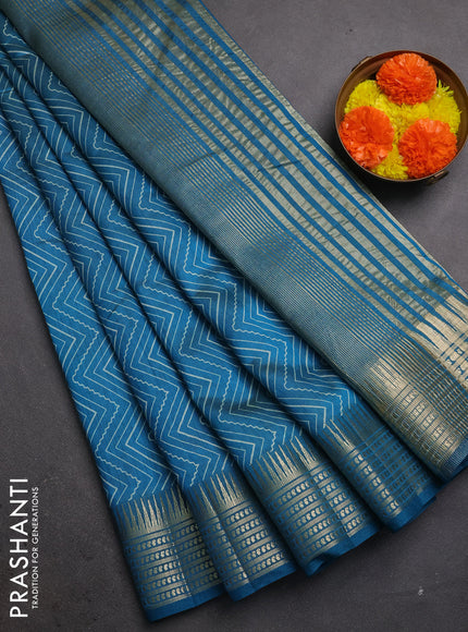 Semi raw silk saree teal blue with allover zigzag prints and temple design zari woven border