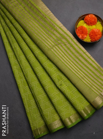 Semi raw silk saree light green with allover geometric prints and zari woven border