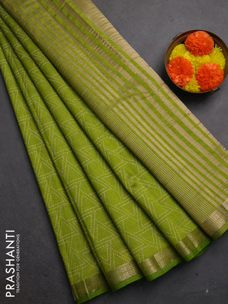 Semi raw silk saree light green with allover geometric prints and zari woven border