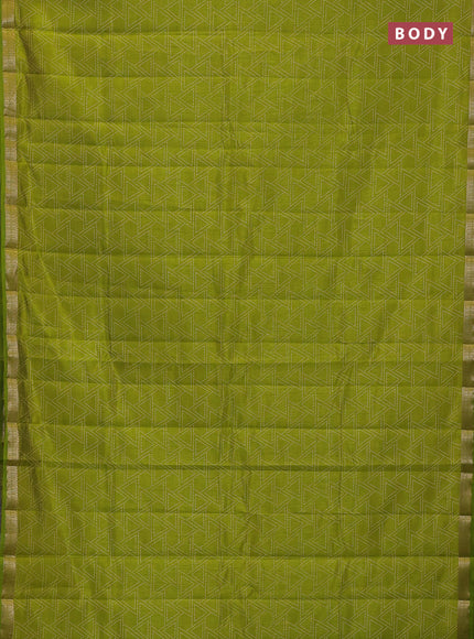 Semi raw silk saree light green with allover geometric prints and zari woven border