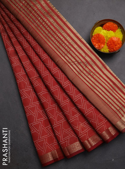 Semi raw silk saree rust shade with allover geometric prints and zari woven border