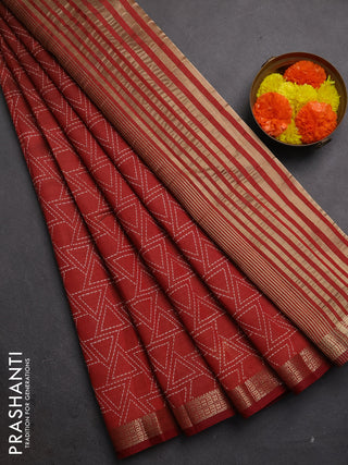 Semi raw silk saree rust shade with allover geometric prints and zari woven border