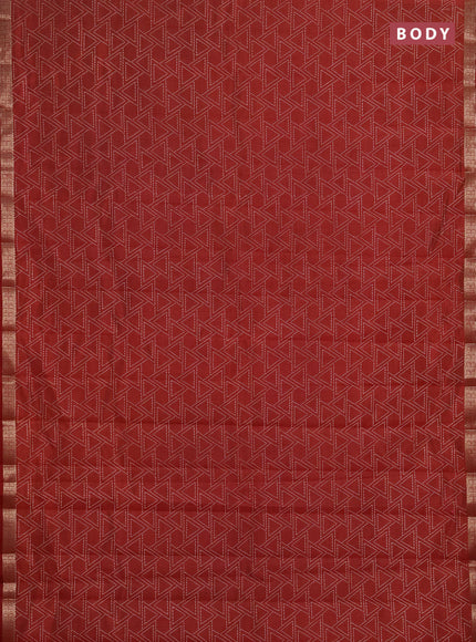 Semi raw silk saree rust shade with allover geometric prints and zari woven border