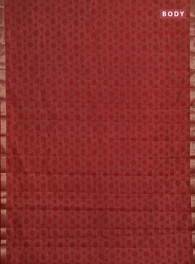 Semi raw silk saree rust shade with allover geometric prints and zari woven border