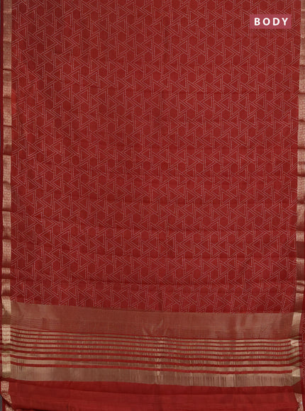 Semi raw silk saree rust shade with allover geometric prints and zari woven border