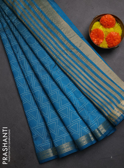 Semi raw silk saree teal blue with allover geometric prints and zari woven border