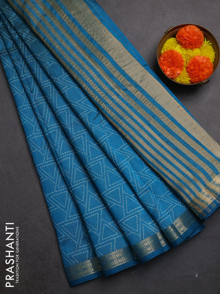 Semi raw silk saree teal blue with allover geometric prints and zari woven border