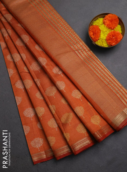 Semi raw silk saree rustic orange with allover butta prints and small zari woven border