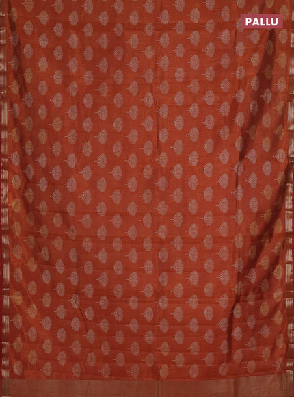 Semi raw silk saree rustic orange with allover butta prints and small zari woven border