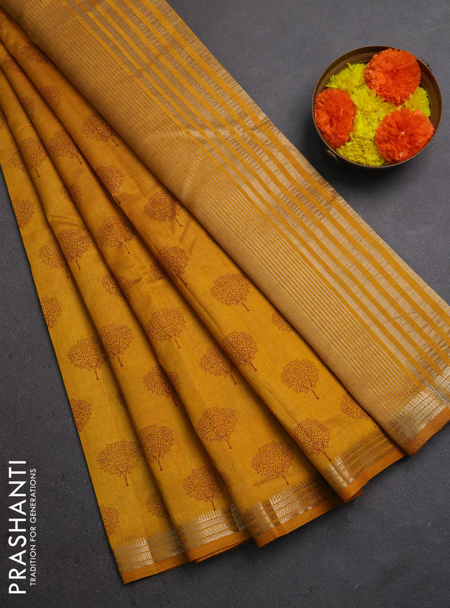 Semi raw silk saree dark mustard with allover butta prints and small zari woven border