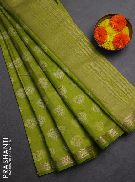 Semi raw silk saree light green with allover butta prints and small zari woven border