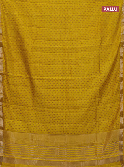 Semi raw silk saree mustard yellow with allover butta prints and zari woven border