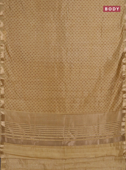 Semi raw silk saree sandal with allover butta prints and zari woven border
