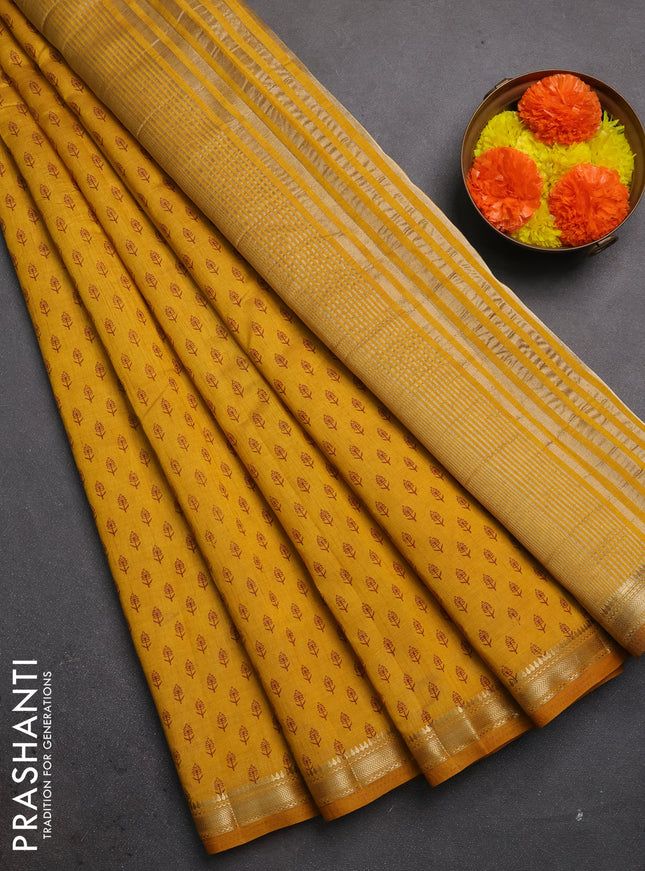 Semi raw silk saree dark mustard shade with allover butta prints and zari woven border